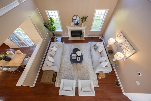 3 Lexington Dr, Walpole, MA 02032 - living room with wood finished floors, baseboards, and a fireplace with flush hearth