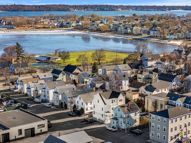 birds eye view of property featuring a water view and a residential view