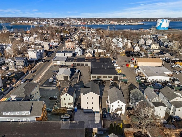 birds eye view of property featuring a water view and a residential view