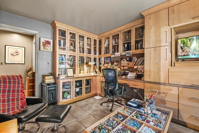 home office featuring light tile patterned flooring