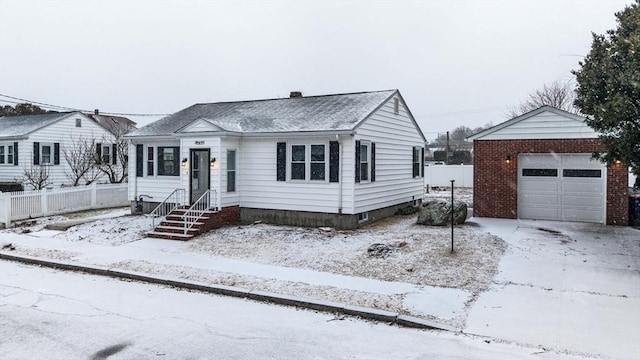 view of front of house featuring a garage and an outdoor structure