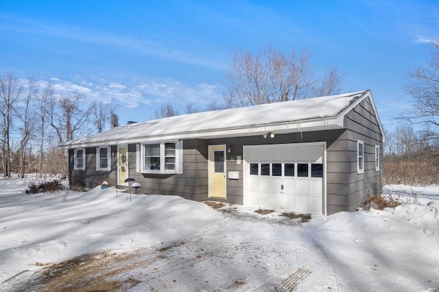 ranch-style home featuring a garage