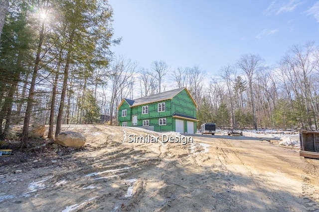 exterior space with an attached garage and driveway