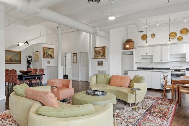 150 Moody St Unit 34, Waltham, MA 02453 - living area featuring dark wood-style flooring and a high ceiling