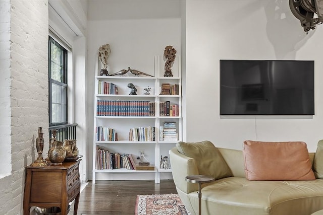 150 Moody St Unit 34, Waltham, MA 02453 - living area featuring wood finished floors and brick wall