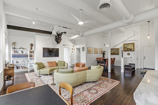 150 Moody St Unit 34, Waltham, MA 02453 - living room featuring dark wood-type flooring, a towering ceiling, ceiling fan, rail lighting, and beam ceiling