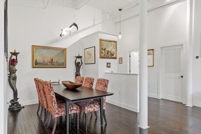 150 Moody St Unit 34, Waltham, MA 02453 - dining space with dark wood-style floors, decorative columns, baseboards, and a high ceiling