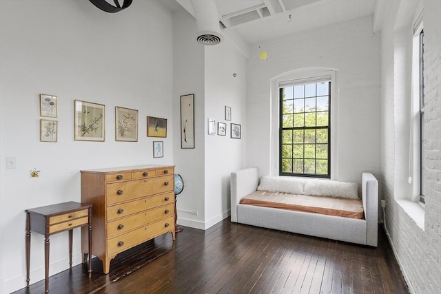 150 Moody St Unit 34, Waltham, MA 02453 - living area featuring wood-type flooring, beam ceiling, and baseboards