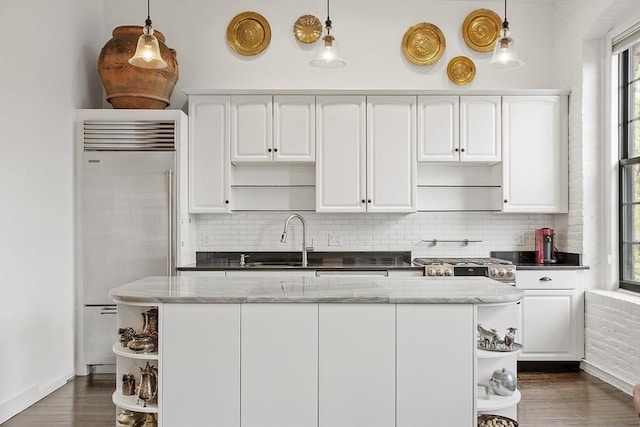 150 Moody St Unit 34, Waltham, MA 02453 - kitchen featuring open shelves, built in refrigerator, a sink, and backsplash