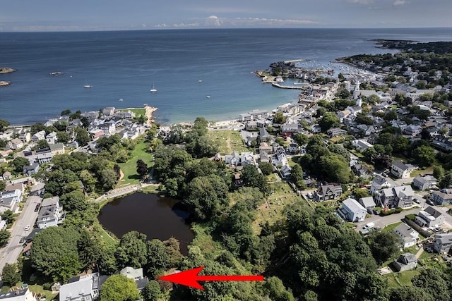 drone / aerial view featuring a residential view and a water view