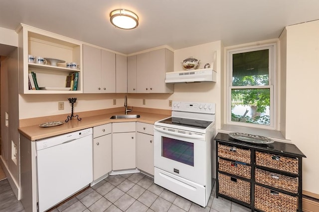 kitchen with white appliances, open shelves, a sink, light countertops, and under cabinet range hood