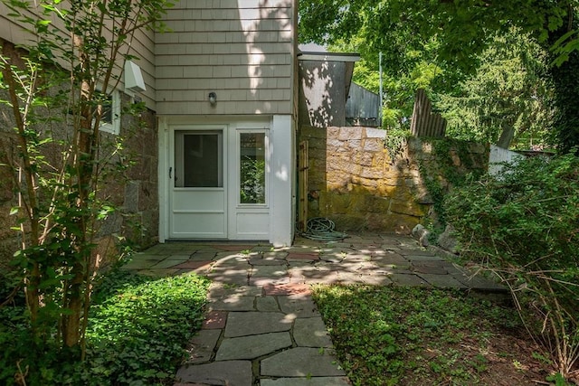 property entrance with a patio area