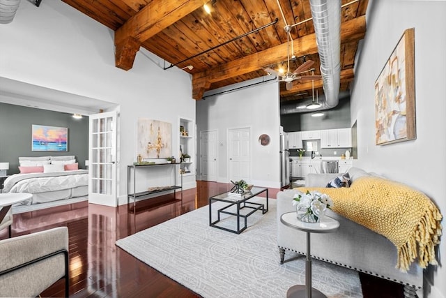 37 Millyard Unit 206, Amesbury, MA 01913 - living area featuring wood finished floors, wood ceiling, beamed ceiling, and a high ceiling