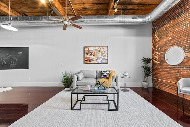 37 Millyard Unit 206, Amesbury, MA 01913 - living area featuring a towering ceiling, wood finished floors, brick wall, a ceiling fan, and baseboards