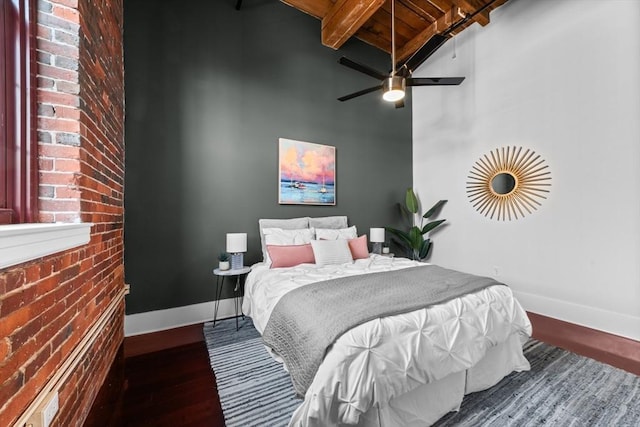 37 Millyard Unit 206, Amesbury, MA 01913 - bedroom with baseboards, wood finished floors, beamed ceiling, a high ceiling, and ceiling fan