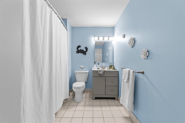 37 Millyard Unit 206, Amesbury, MA 01913 - bathroom featuring tile patterned floors, toilet, vanity, baseboards, and a shower with curtain