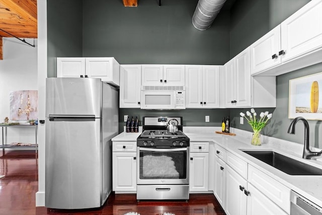 37 Millyard Unit 206, Amesbury, MA 01913 - kitchen with appliances with stainless steel finishes, a sink, light countertops, and white cabinets
