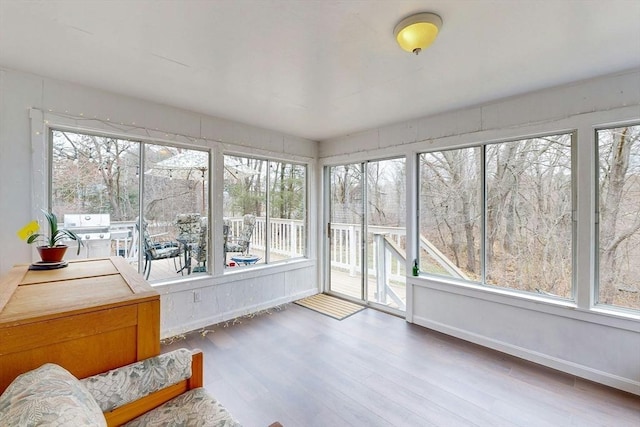 sunroom with wood finished floors