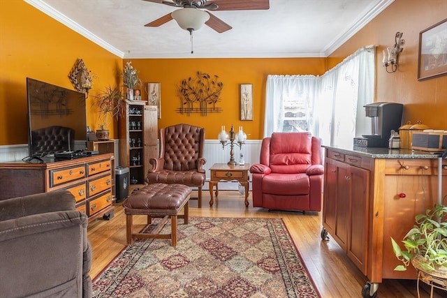 224 Palmer Rd, Monson, MA 01057 - living area featuring a ceiling fan, crown molding, light wood-style floors, and a wainscoted wall