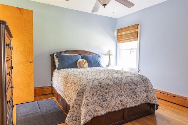 224 Palmer Rd, Monson, MA 01057 - bedroom featuring wood finished floors, a baseboard heating unit, and a ceiling fan