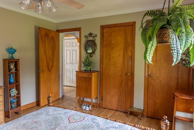 224 Palmer Rd, Monson, MA 01057 - bedroom featuring crown molding, arched walkways, wood finished floors, and ceiling fan