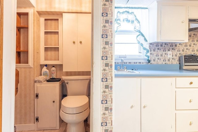 224 Palmer Rd, Monson, MA 01057 - bathroom with a sink, toilet, and tasteful backsplash