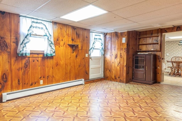 224 Palmer Rd, Monson, MA 01057 - unfurnished room with baseboard heating and wood walls