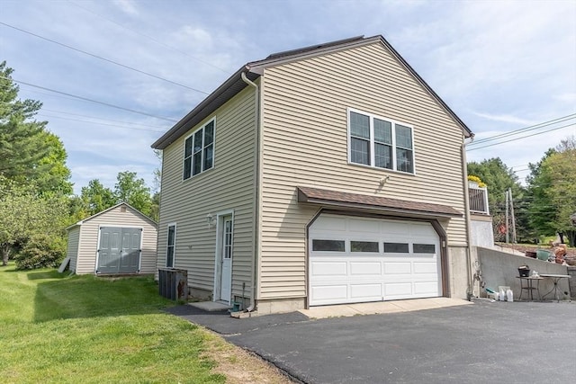 224 Palmer Rd, Monson, MA 01057 - view of side of home with driveway, a garage, a shed, a yard, and an outdoor structure