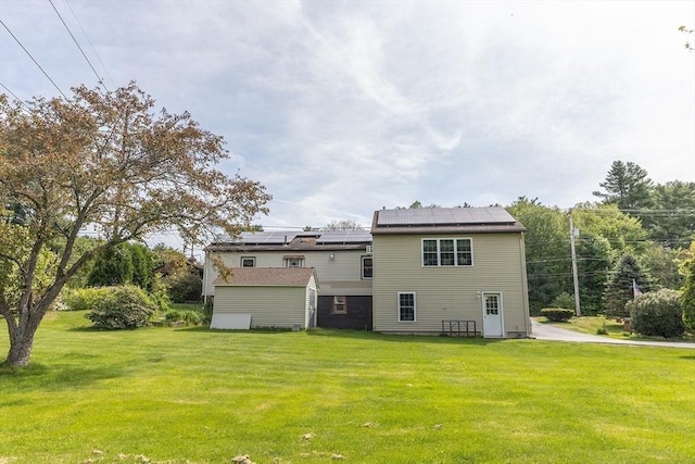 224 Palmer Rd, Monson, MA 01057 - back of property featuring a yard, solar panels, and a storage shed