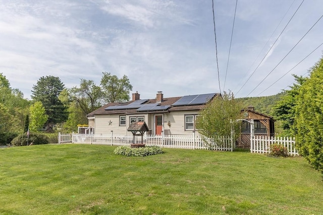 224 Palmer Rd, Monson, MA 01057 - back of house with roof mounted solar panels, a gazebo, and a chimney