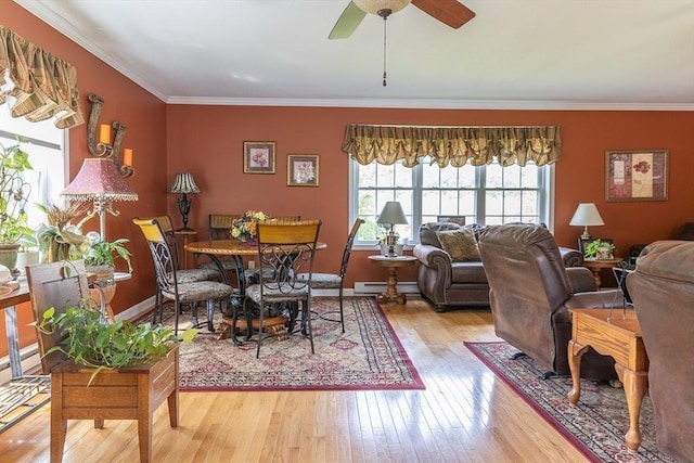 224 Palmer Rd, Monson, MA 01057 - dining area featuring a baseboard heating unit, wood-type flooring, ornamental molding, ceiling fan, and baseboards