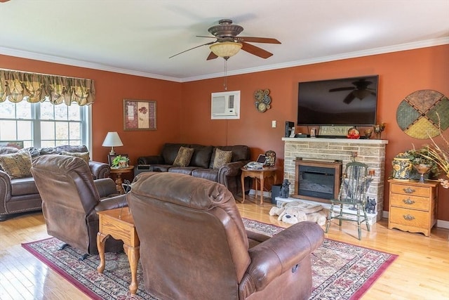 224 Palmer Rd, Monson, MA 01057 - living room with wood finished floors, a ceiling fan, ornamental molding, and a stone fireplace