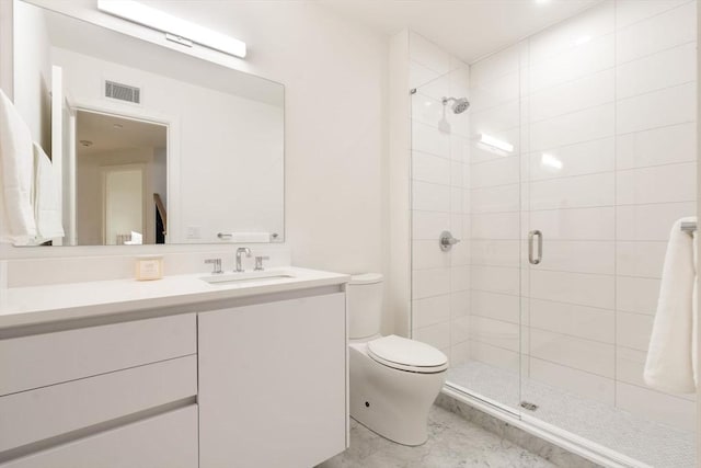 bathroom featuring toilet, vanity, and walk in shower