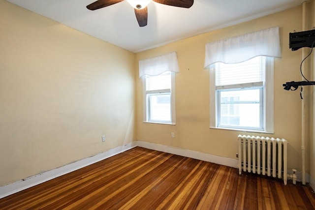 30 Partridge Ave, Somerville, MA 02145 - spare room with radiator heating unit, wood finished floors, ceiling fan, and baseboards