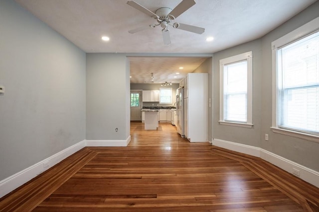 30 Partridge Ave, Somerville, MA 02145 - unfurnished living room featuring light wood-style floors, baseboards, ceiling fan, and recessed lighting