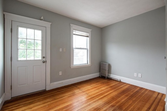 30 Partridge Ave, Somerville, MA 02145 - entryway featuring light wood-style floors, radiator, and baseboards