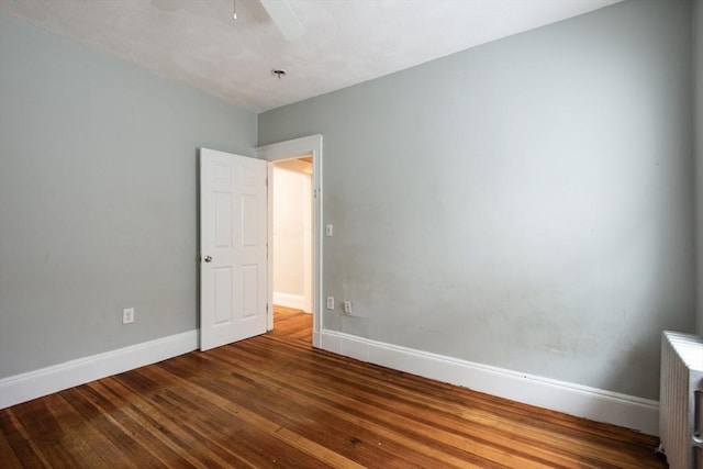 30 Partridge Ave, Somerville, MA 02145 - empty room with wood finished floors, baseboards, and ceiling fan