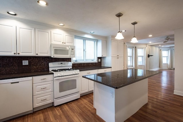 30 Partridge Ave, Somerville, MA 02145 - kitchen featuring white appliances, white cabinets, dark wood-style floors, and recessed lighting