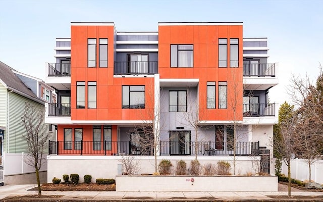 exterior space with fence and stucco siding