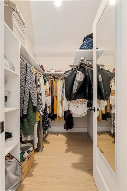 spacious closet with wood finished floors