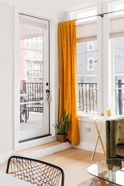 doorway to outside featuring wood finished floors