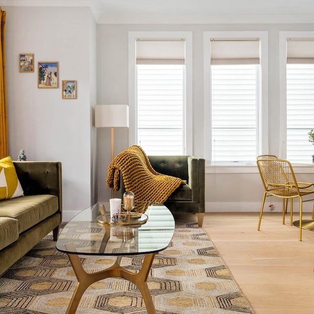 sitting room with wood finished floors and baseboards