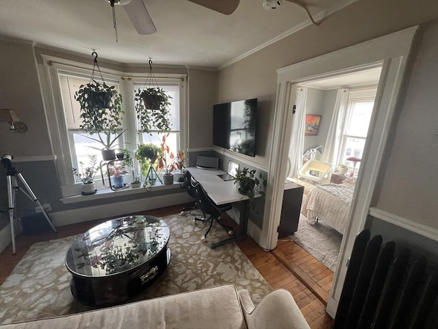 office with crown molding, ceiling fan, plenty of natural light, and wood finished floors
