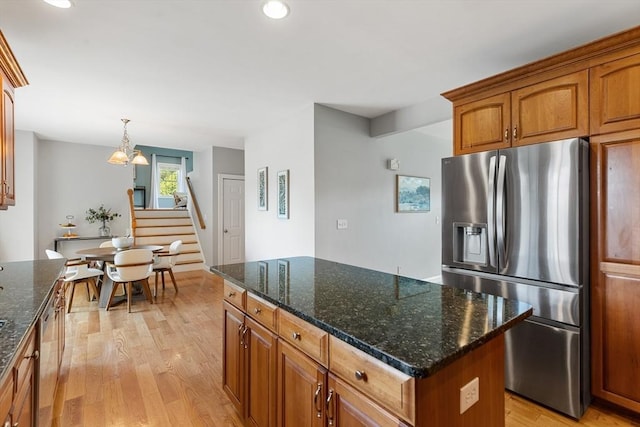 20 Hillside Dr, Georgetown, MA 01833 - kitchen with stainless steel fridge, light wood-type flooring, a center island, brown cabinets, and a chandelier