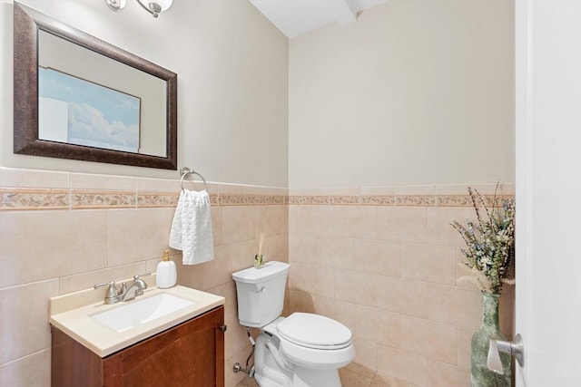 20 Hillside Dr, Georgetown, MA 01833 - half bathroom featuring vanity, tile walls, and a wainscoted wall
