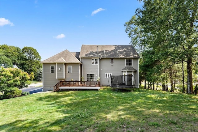 20 Hillside Dr, Georgetown, MA 01833 - rear view of property featuring a deck, a yard, and a trampoline