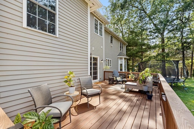 20 Hillside Dr, Georgetown, MA 01833 - wooden deck with a trampoline