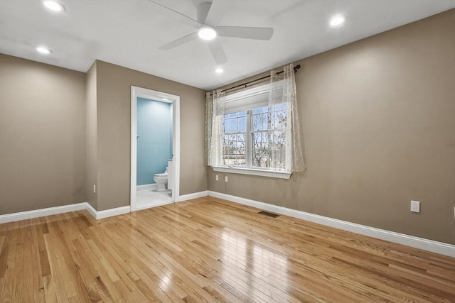 unfurnished room featuring ceiling fan and light hardwood / wood-style flooring