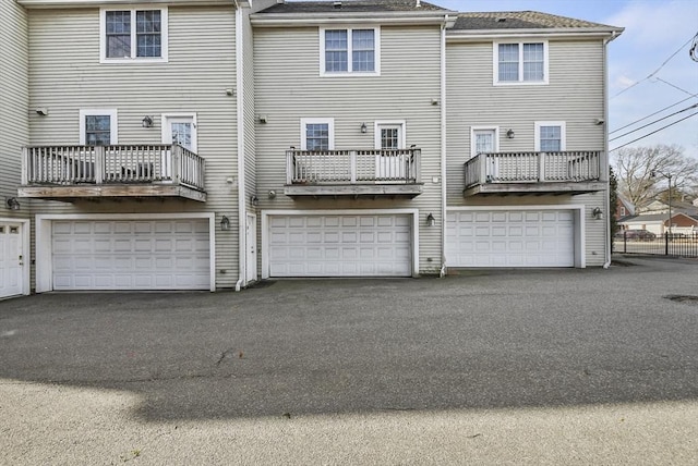 rear view of property with a balcony