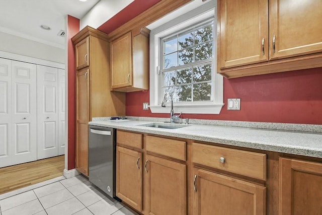 kitchen with light stone countertops, sink, stainless steel dishwasher, light tile patterned flooring, and ornamental molding